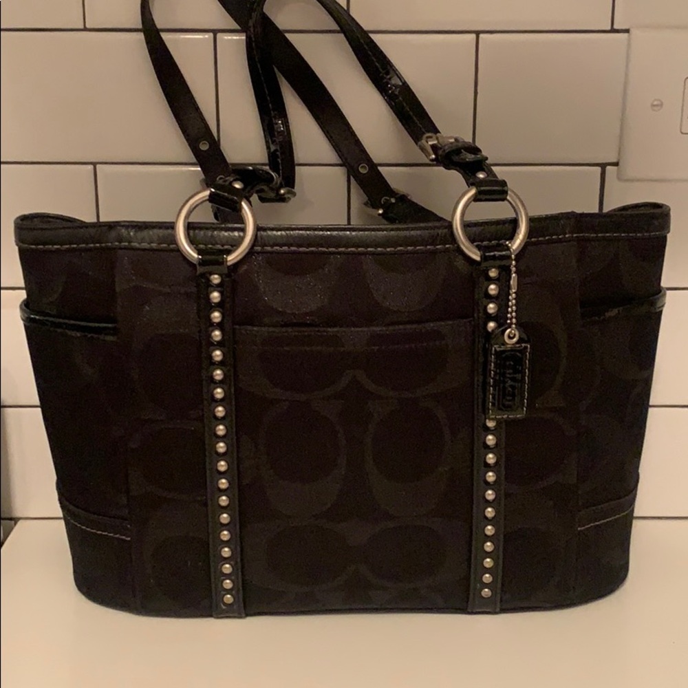 Black Coach tote with large metallic C’s